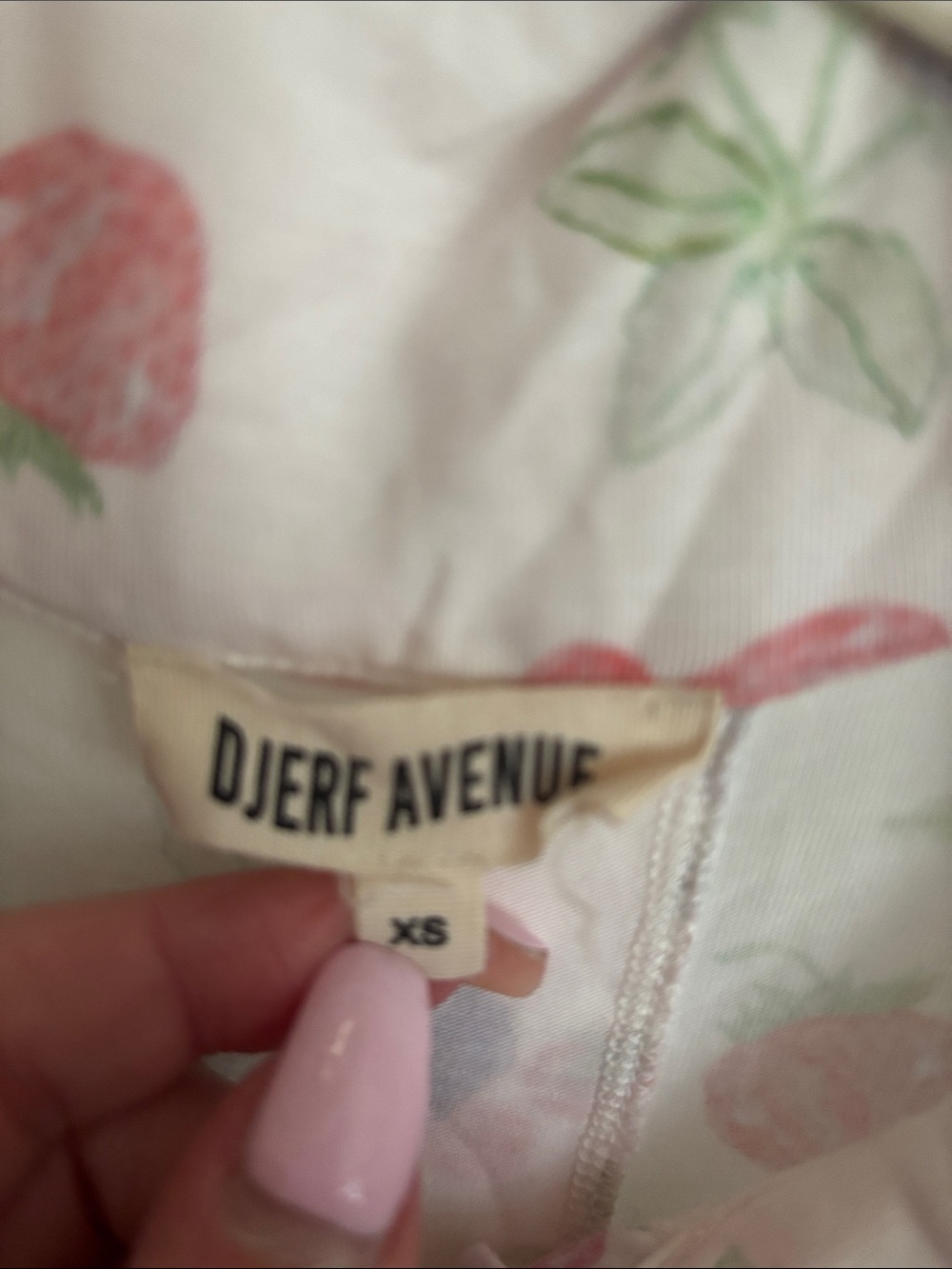 Djerf Avenue Light Pink Strawberry-Print Pajama Top and bottoms.